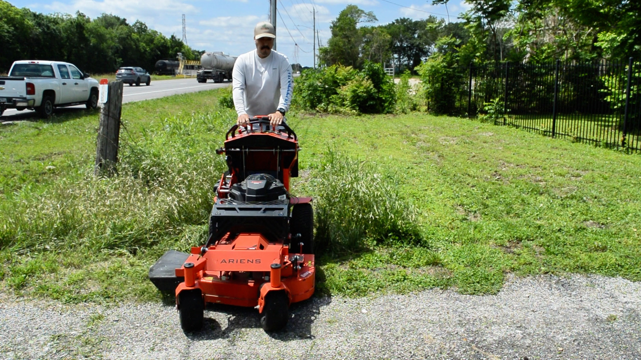 Nate, owner of Promised Landscaping, on the job